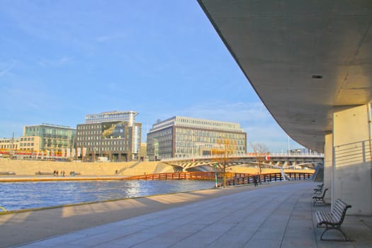 The bank of the river on a tranquil summer evening in the heart of the city.