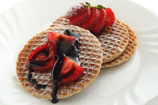 waffles with strawberry and sauce