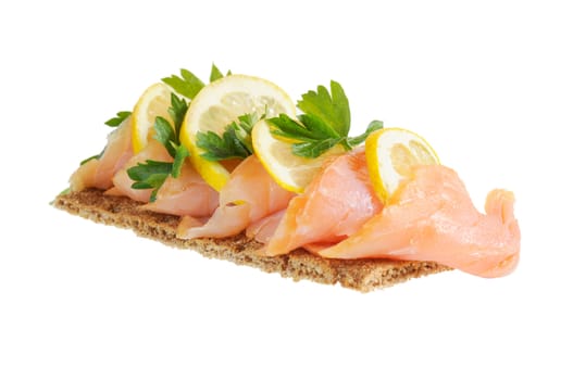 Sandwich snack - salmon with lemon on rye bread. Isolated on white.