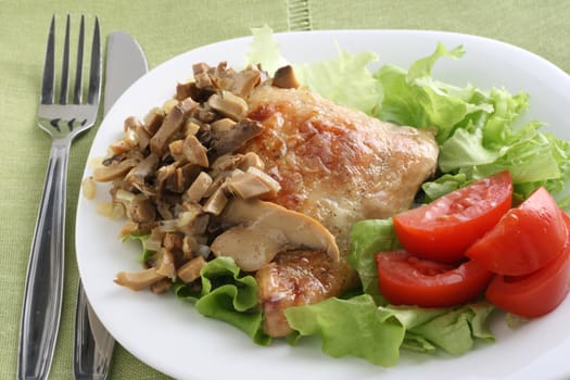 fried chicken with mushrooms and salad