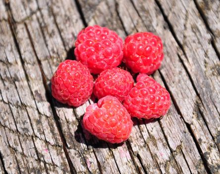 Raspberries on wood