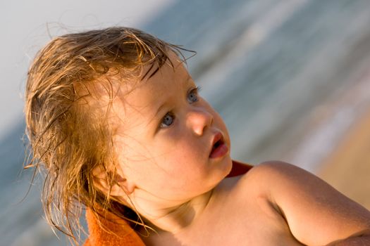 people series: portrait of little girl in orange towel