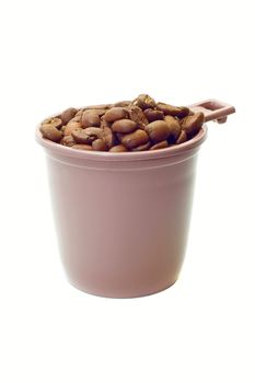 Cup with coffee beans on white