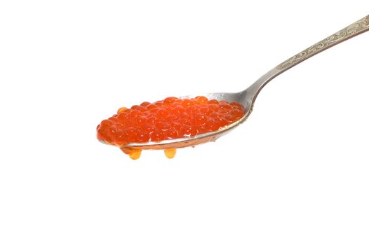 Red caviar at spoon on white background