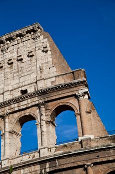Colosseum in Rome with blue sky, landmark of the city
