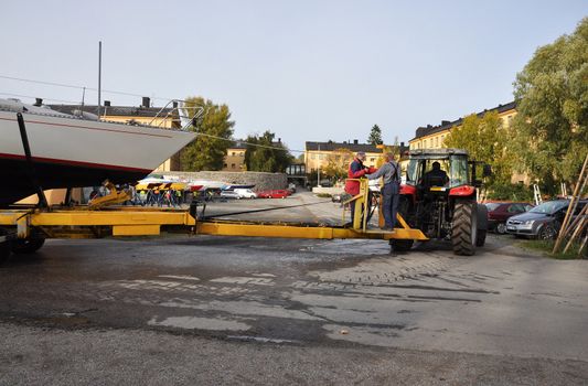 STOCKHOLM OKTOBER 7 2011. Transporting the boat in to drystock for the winter.