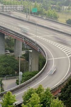 Interchange in highway with cars motion blurred in daytime in Taipei, Taiwan, Asia.