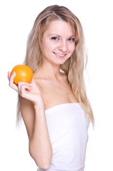 smiling young haelthy woman holding the orange in her hand