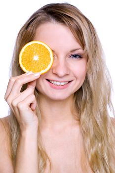 smiling young haelthy woman holding the orange in her hand