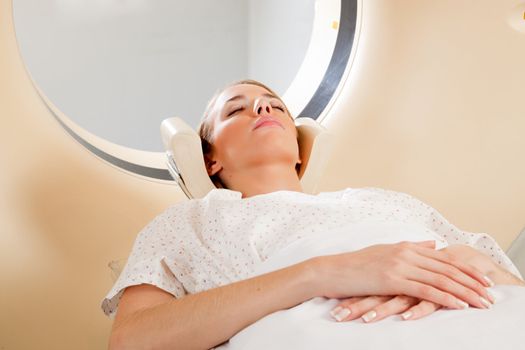 A young female taking a CT scan - medical testing