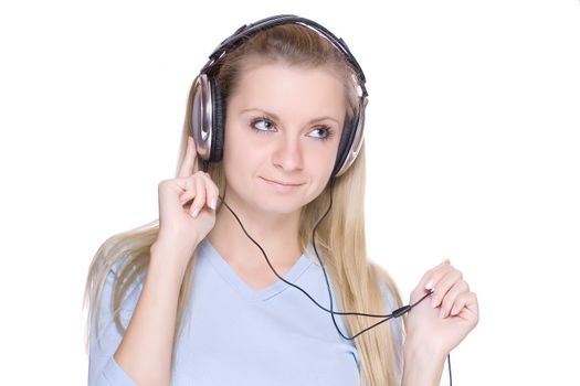 Isolated smiling young girl listening to music