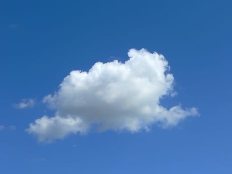 a cloud in the blue sky