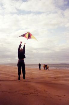 a jump for joy on the beach