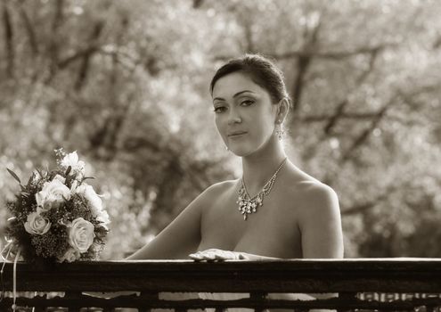 Portrait of the beautiful bride with a bouquet