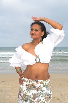 A Caribbean model posing at the beach