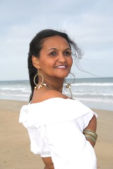 An Ethnic model posing at the beach