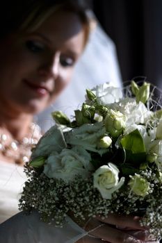 The beautiful bride in a car