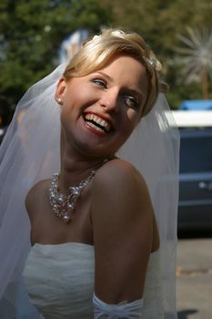 Beautiful smiles of the bride of the blonde. The happy Bride.