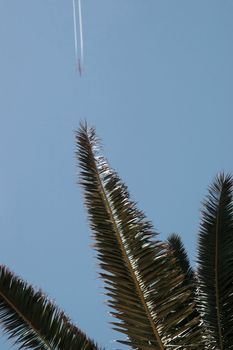 plane in flight leaving a carbon trail