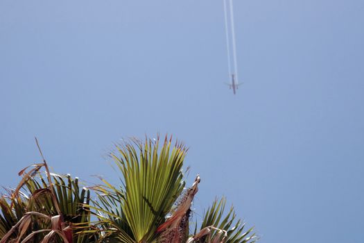 plane in flight leaving a carbon trail