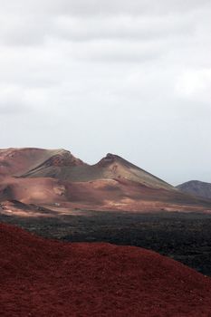 a bus travelling on the volcanic landscape