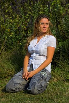 Attractive girl looking to her left in the garden