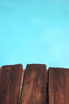 standing at the edge of the pool side