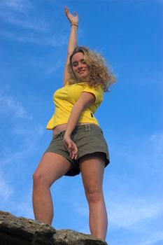 Girl in yellow top and Khaki Shorts