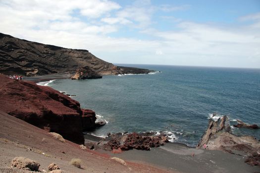 the coast line of a volcanic island