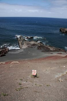 the coast line of a volcanic island