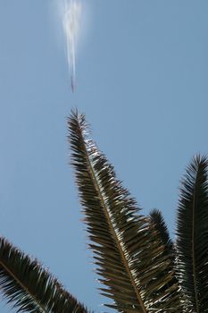 plane in flight leaving a carbon trail