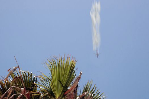 plane in flight leaving a carbon trail