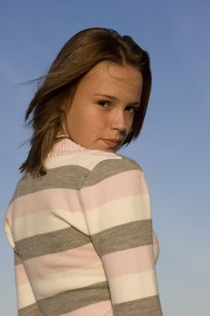 Portrait of an attractive Teenager with blue sky background