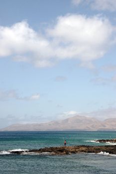 a view of a man fishing in lanzarote