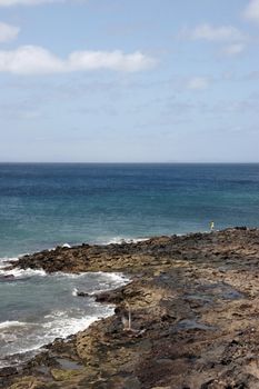 a view of a man fishing in lanzarote