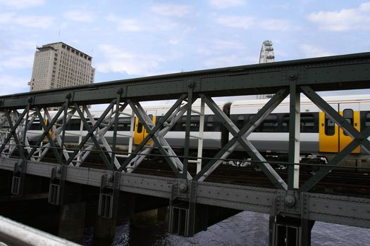 train passing over a bridge in london city