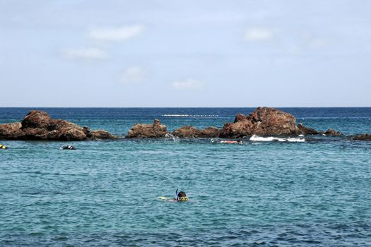 holiday makers out in the sea suba diving