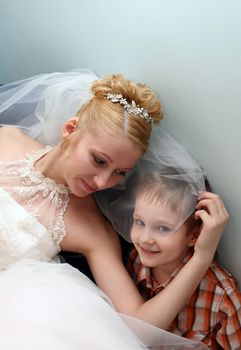 The beautiful bride with the little boy
