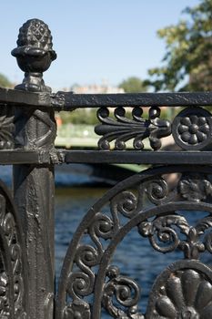 Ancient wrought-iron fence on quay of the river in St.Petersburg