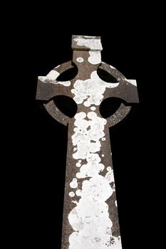 a celtic cross in an irish graveyard