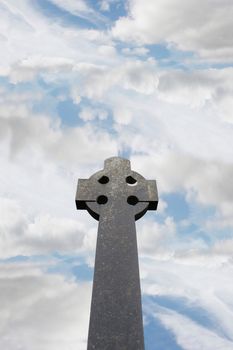 a celtic cross in an irish graveyard