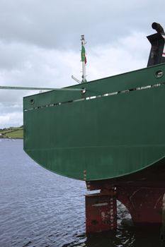 steel cargo ship docked in the bay