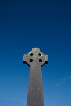 a celtic cross in an irish graveyard