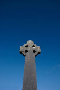 a celtic cross in an irish graveyard