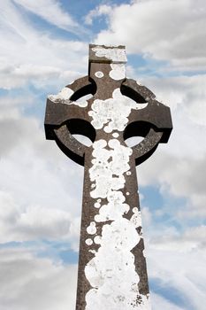 a celtic cross in an irish graveyard