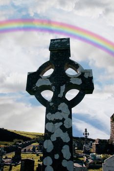 a celtic cross in an irish graveyard