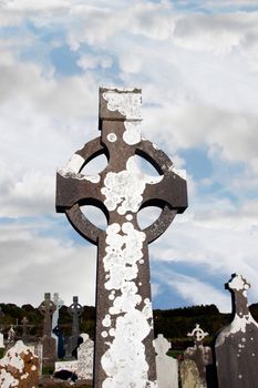 a celtic cross in an irish graveyard