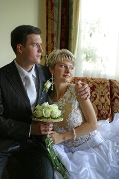 Newly-married couple in an interior