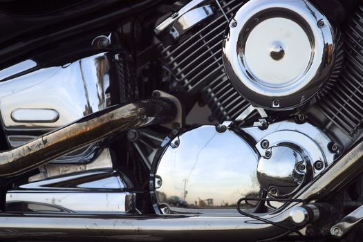 Part of a motorcycle with reflections