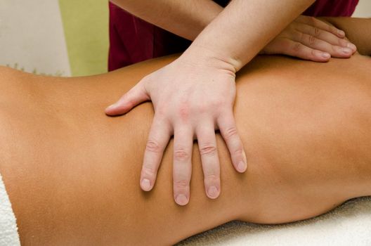 closeup of young woman getting a back massage